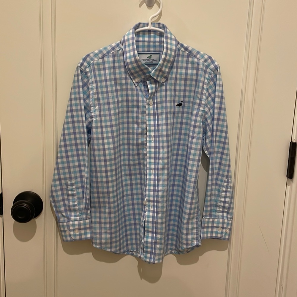 Properly tied button up. Size 6